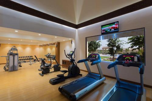 a gym with a row of exercise bikes in a room at Welcomhotel by ITC Hotels, Jodhpur in Jodhpur