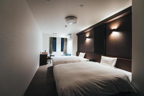 Кровать или кровати в номере TAPSTAY HOTEL - Vacation STAY 35239v