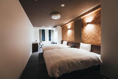 Llit o llits en una habitació de TAPSTAY HOTEL - Vacation STAY 35237v