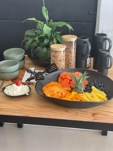 a table with a plate of vegetables and other foods at Views over Wilderness in Wilderness