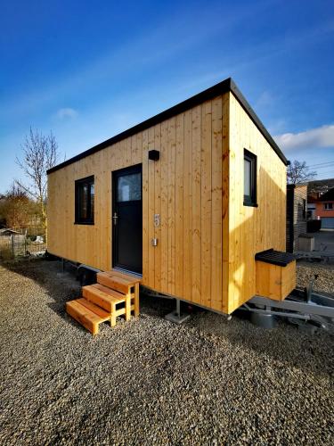 a tiny house sitting on top of a pile of gravel at Landhaus Herdt in Lauda-Königshofen