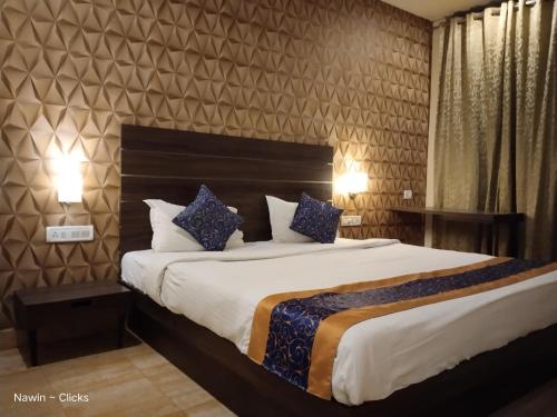 Postel nebo postele na pokoji v ubytování Redfox Hotel- Aminjikarai