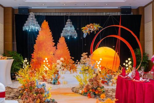 a display of christmas trees and lights on a stage at Marco Polo Xiamen in Xiamen