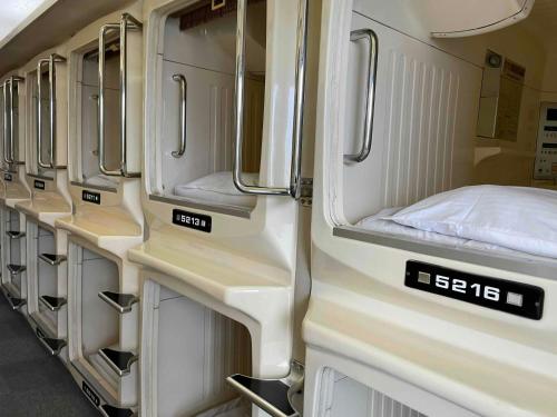 an interior of an rv with a bed in it at 男性専用サウナ&カプセル Men Only Capsule Room & Sauna, Bathhouse ミナミ下北沢 Minami Shimokitazawa in Tokyo