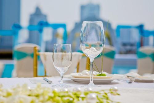 two wine glasses sitting on top of a table at Marco Polo Xiamen in Xiamen