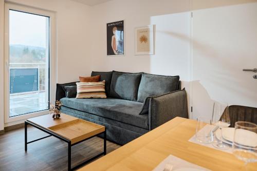 Ruang duduk di Moderne Apartments mit Highspeed-WLAN und Tiefgarage Ihr perfekter Rückzugsort nahe dem Zentrum und der Therme I BARRIEREARM