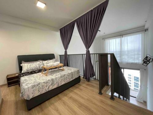 a bedroom with a bed and a large window at E1 Emporis Duplex SEGI KD Tropicana IKEA One Utama in Petaling Jaya