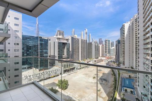 an apartment balcony with a view of a city at Lovely Studio in Business Bay in Dubai
