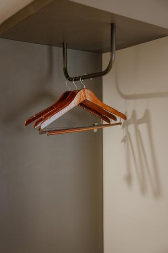a wooden hanger hanging from a ceiling at Horison Ultima Seminyak Bali - CHSE Certified in Seminyak