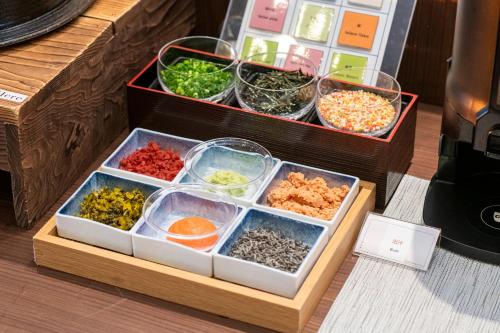 a wooden box with different types of food in it at Shibuya Excel Hotel Tokyu in Tokyo