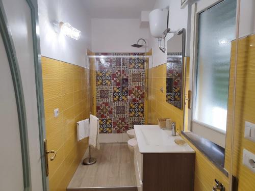 a bathroom with a sink and a toilet and a shower at Agriturismo Fuoco D'Amalfi Villa Iazzetta in Amalfi