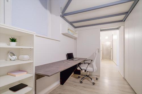 an office with a desk and a chair at Castle Proximity Suite by Rentez in Prague