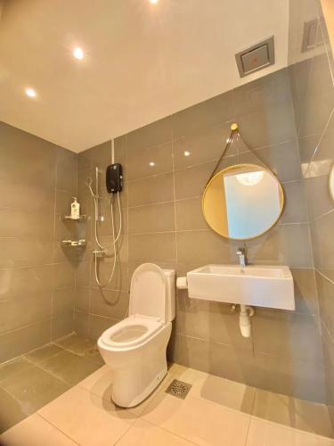 a bathroom with a toilet and a sink at imperium residence kuantan in Kuantan