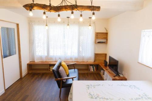 Televisyen dan/atau pusat hiburan di PREERIA House in JEJU