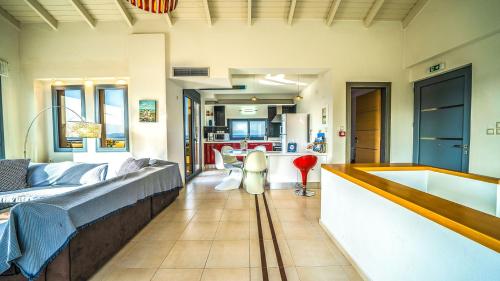 a living room with a couch and a tub at Anemon Villas in Kissamos