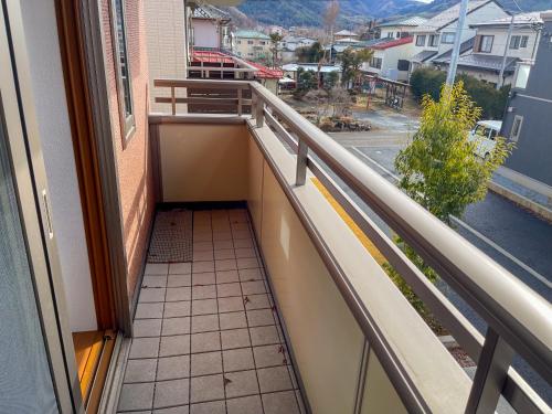 a balcony with a view of a street at New open 新築の上質な宿【FTHIvory】 in Fujiyoshida