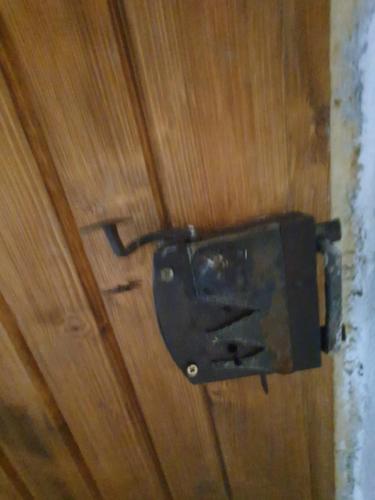 a toilet paper dispenser on a wooden door at Casa Bunicii in Topliţa