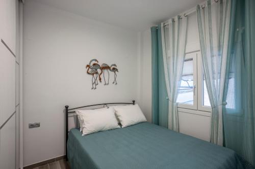 Кровать или кровати в номере Flamingo deluxe studio