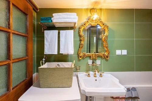 a bathroom with a sink and a mirror at Shanghai Hills & Well-time MCM Family B&B with 2 Bedrooms in Shanghai