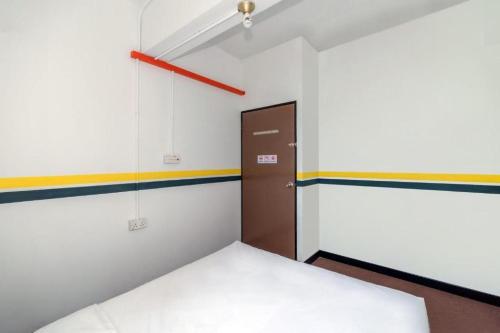 Katil atau katil-katil dalam bilik di Sutera Inn Inanam