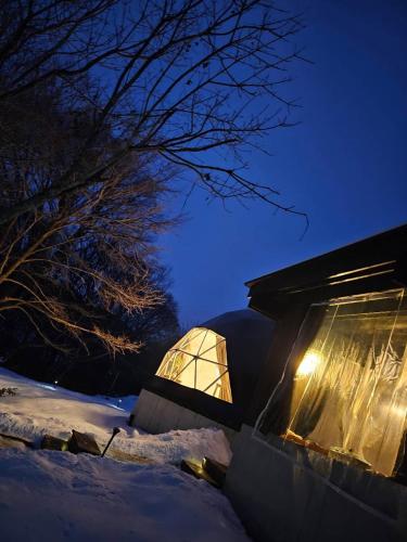 a dome house in the snow at night at villa福座 in Furusan