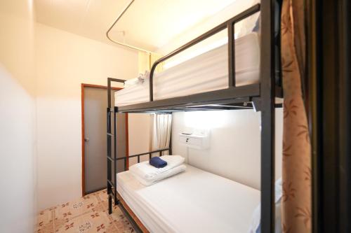 Postel nebo postele na pokoji v ubytování Baan Kamala Backpacker