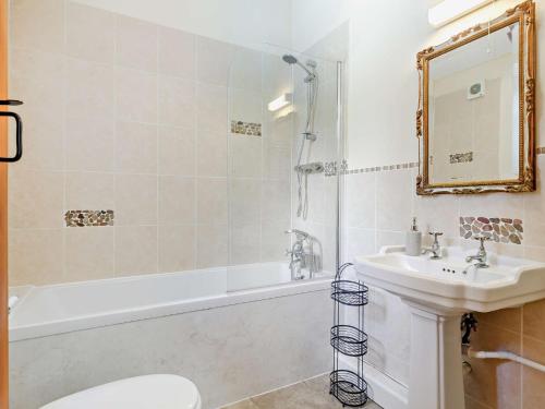 a bathroom with a sink and a tub and a toilet at 2 Bed in Callington TYLER in North Hill
