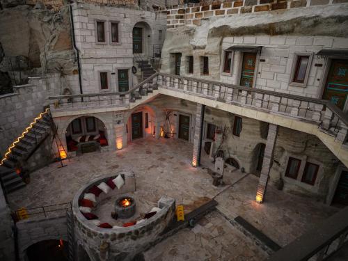 an overhead view of an old building with a staircase at Lost City Cappadocia Cave Hotel in Nar