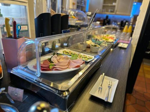 a buffet line with many different types of food at Hotel Zum Goldenen Anker in Bamberg