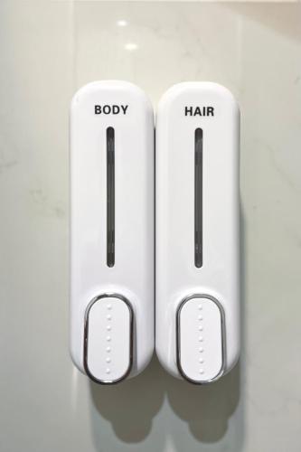 two white wii controllers sitting next to each other at Dooga Ins-Dreamspace L37 Seaview Projector 1-6pax in Johor Bahru