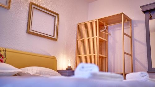 a bedroom with a bed and a book shelf at Family TreeZ Premium Apartments in Poiana Brasov