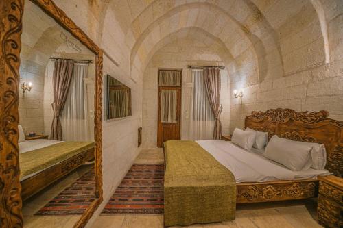 Un ou plusieurs lits dans un hébergement de l'établissement Capp Royal Cave HOTEL