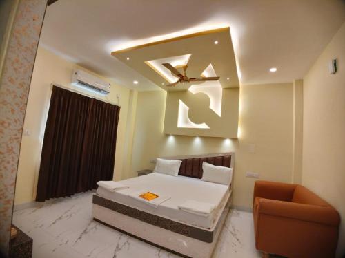 Ein Bett oder Betten in einem Zimmer der Unterkunft Hindusthan Inn - On Beach