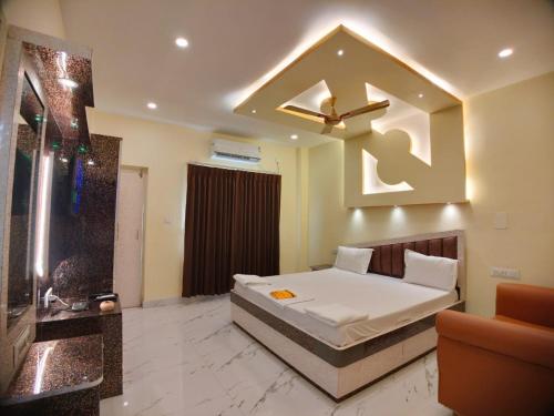 Ein Bett oder Betten in einem Zimmer der Unterkunft Hindusthan Inn - On Beach