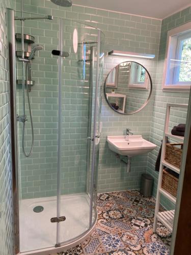 a bathroom with a shower and a sink at Refugium Augustin in Vienna