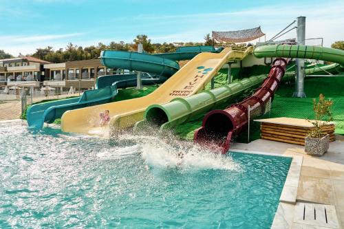 a water slide in a water park at Trypiti Resort Blue Dream Palace and Hive Water Park in Limenaria
