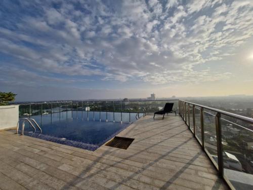 a balcony with a swimming pool on top of a building at The Fortress in Sri Jayewardenepura Kotte