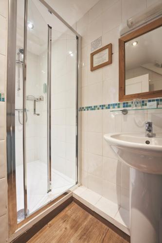a bathroom with a shower and a sink at Great Western in Newquay