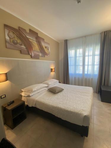 Postel nebo postele na pokoji v ubytování Hotel Montepizzo
