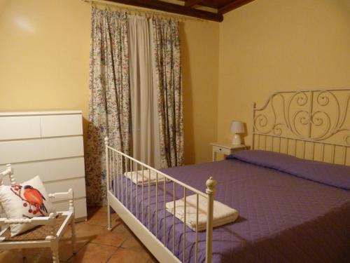 Un pat sau paturi într-o cameră la Poggio Delle Palme