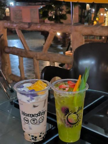 two drinks sitting on top of a table at Birdofparadisehomestay in Ấp Phú Sum