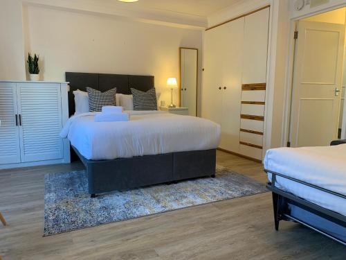 Voodi või voodid majutusasutuse Marlyn Lodge – City of London toas