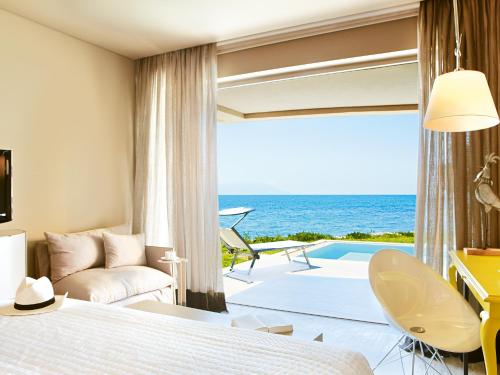 a hotel room with a view of the ocean at Grecotel Astir Palace in Alexandroupoli