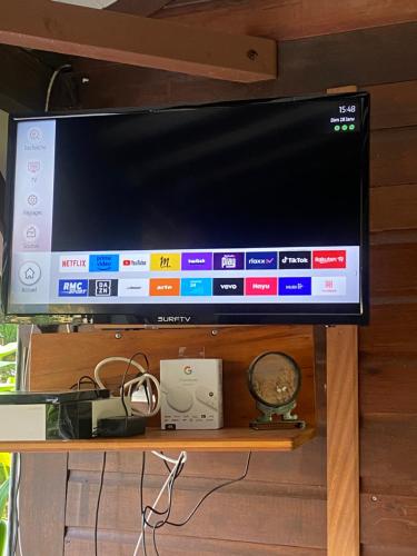 a flat screen tv sitting on top of a table at Habitation Bonneville Chalet et Loft d'exceptions in La Trinité