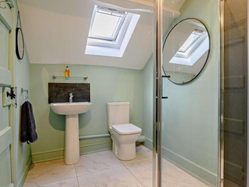 a bathroom with a toilet and a sink and a shower at 3 Bed in Leominster 93304 in Bodenham