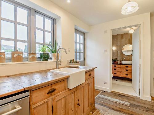 a kitchen with a sink and a window at 2 Bed in Hay-on-Wye 93221 in Hay-on-Wye