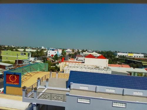 a view of a city from the top of a building at Hostel Đặng Lợi ホステルダンロイ in Chau Doc