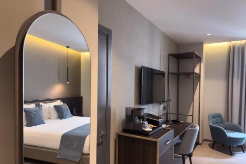 Кровать или кровати в номере Hotel Vitruvio