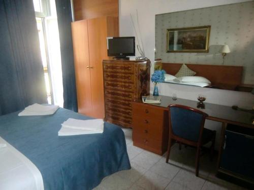 Postel nebo postele na pokoji v ubytování HOTEL SARA