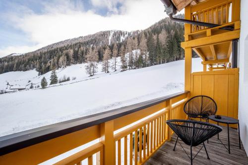 a balcony with a view of a snow covered mountain at Mountain Residence Kasern Nr 1 in Predoi